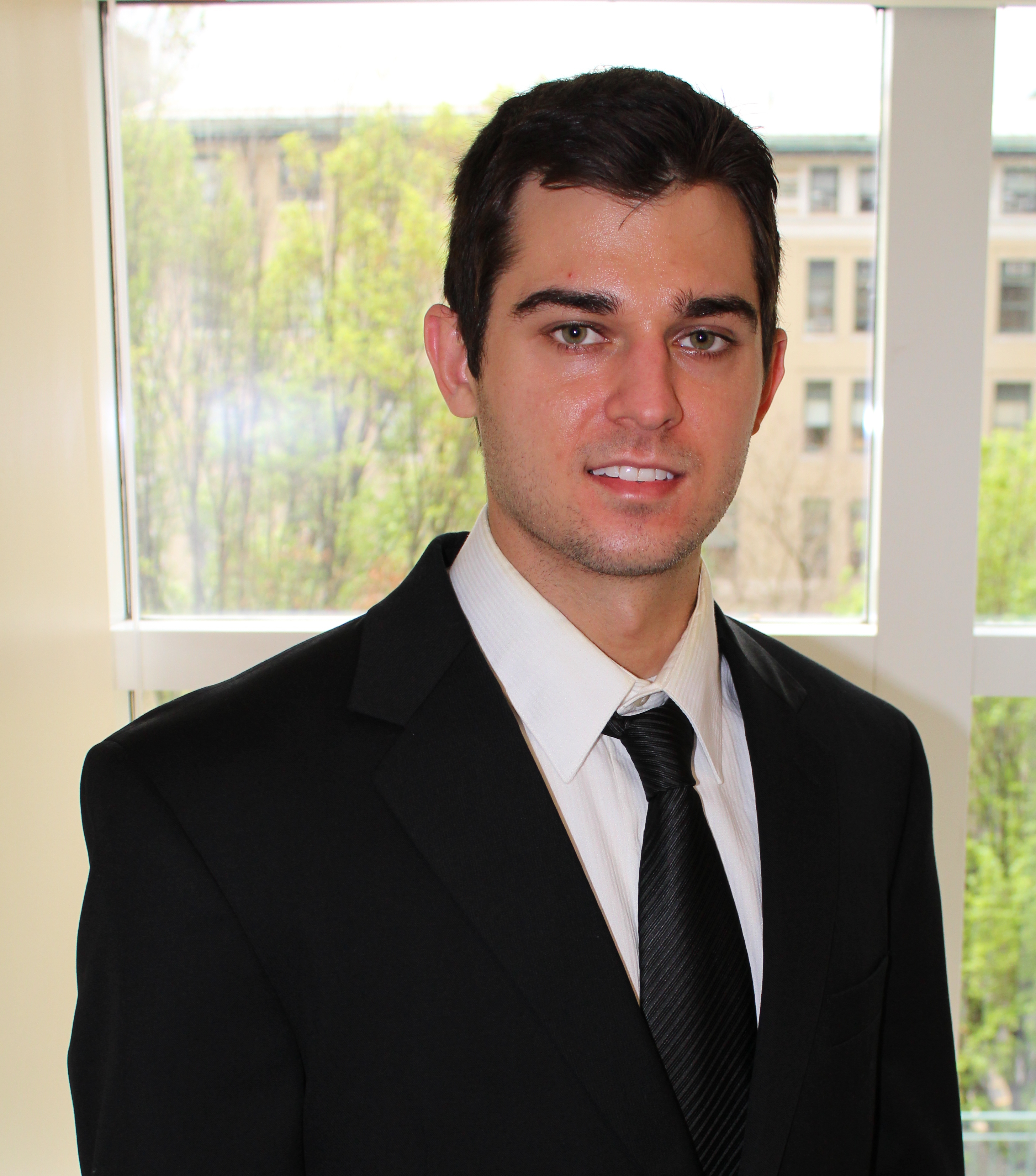 Picture of Zack Coker in a suit